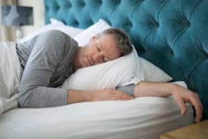 man sleeping at home