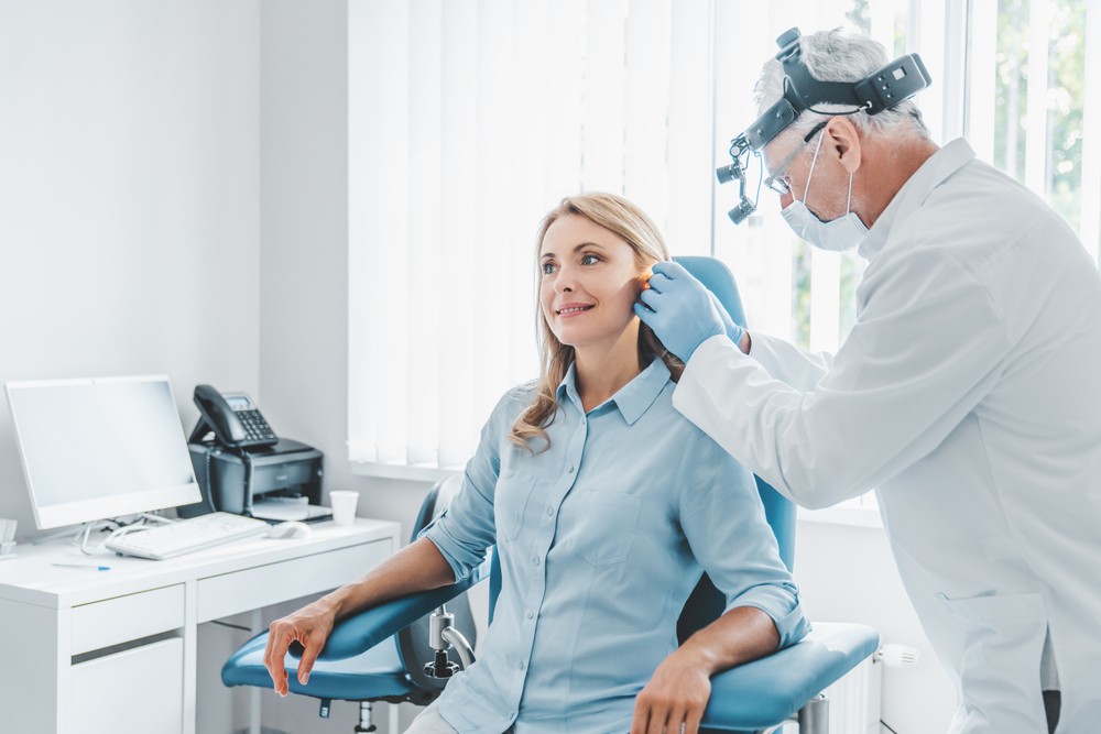 ear doctor with woman