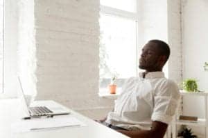 man deep breathing to relieve stress