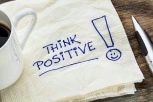 Think positive written on napkin