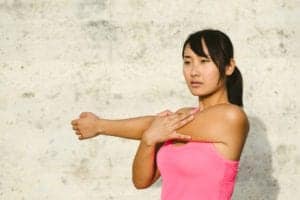 woman doing shoulder stretch